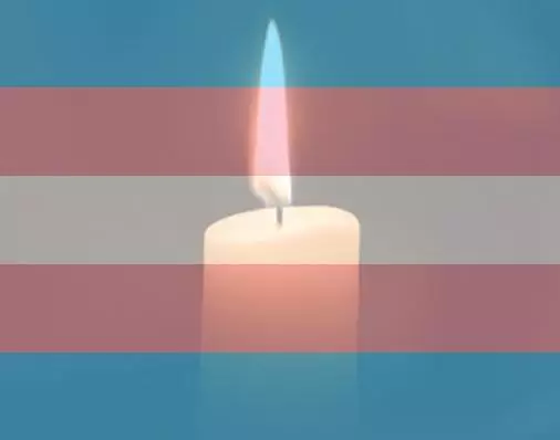 trans flag with candle